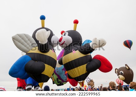 Albuquerque, NM, October 8:  Two bee shaped balloons kiss each other before take off at the Balloon Fiesta in Albuquerque, New Mexico on October 8th, 2014.