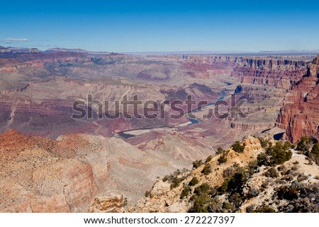 Looking down on the colorful and amazing landscape of the Grand Canyon National Park with the Colorado River running through it in Arizona.