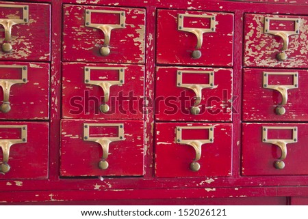 Old red and gold library card catalog.