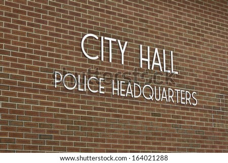 City Hall & Police Headquarters - Simple City Hall - Police Headquarters Sign Against Brick Background
