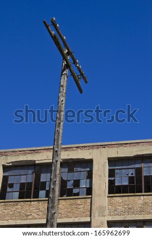 Urban Automotive Blight Telephone Pole - Abandoned Automotive Factory - Worn, Broken and Forgotten