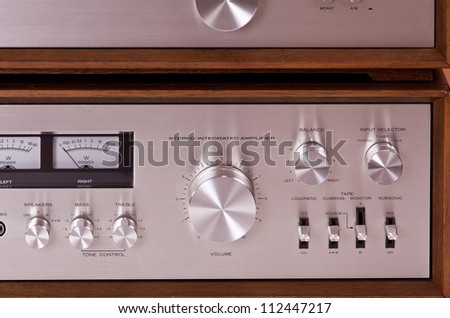 Vintage hi-fi Stereo Amplifier in wooden cabinet front
