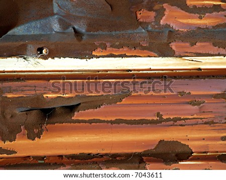 Old metal siding, rusted and ruined makes an interesting textural background