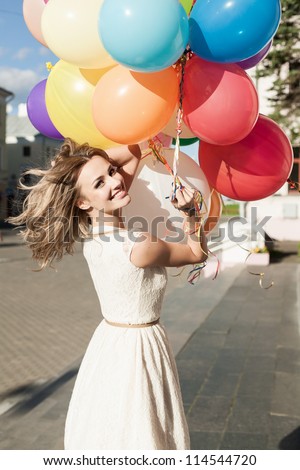 Happy Young Woman With Colorful Latex Balloons Keeping Her Dress, Urban Scene, Outdoors