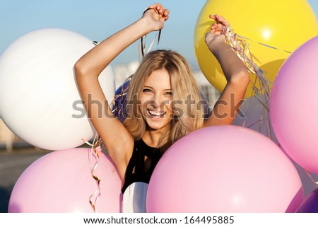 Happy Young Woman Having Fun With Big Colorful Latex Balloons. Outdoors, Lifestyle
