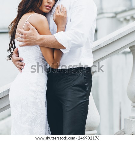 Young couple loving each other. Man hugging a woman.