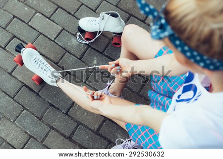 Close-up Of Legs Wearing Roller Skating Shoe, Outdoors lifestyle portrait