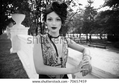 Retro Woman Portrait. Beautiful Woman. Vintage Styled Photo. Old Fashioned Makeup and Finger Wave Hairstyle. 20 or 30 style