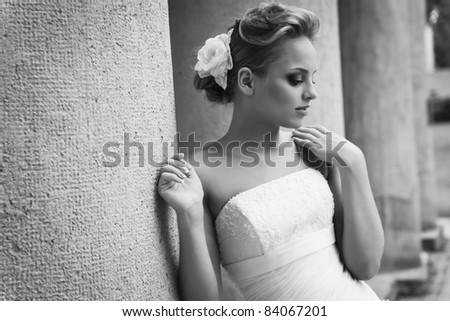 A beautiful bride in the white wedding dress.