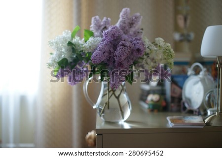 Bunch of lilac on the dresser