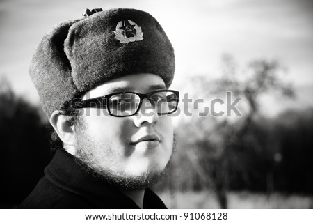 Facial hair young man in Russian fur