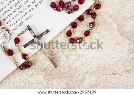 Rosary beads on a book of psalms