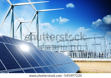 Modern electric grid lines and renewable energy concept with photovoltaic panels and wind turbines