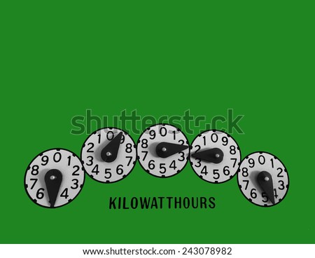 Kilowatt hour electric meter register dials on green background