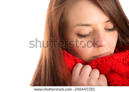 Warm Scarf - This is a shot of a beautiful young woman putting on her warm red scarf.