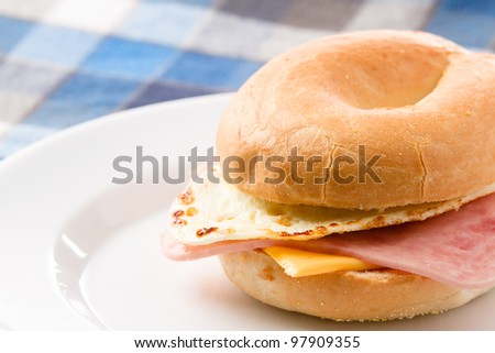 Egg Sandwich / This is a photo of a delicious egg ham and cheese sandwich on a toasted bagel.