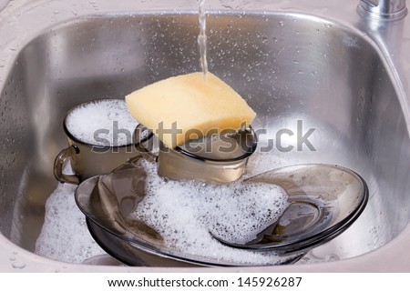 washing dishes. utensils in the sink