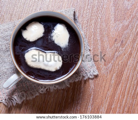 cup of coffee with cream. Coffee cream painted smiley face