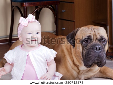 Portrait of a big dog and a little girl