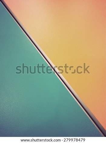 Gap between blue desk and orange desk with vintage tone.