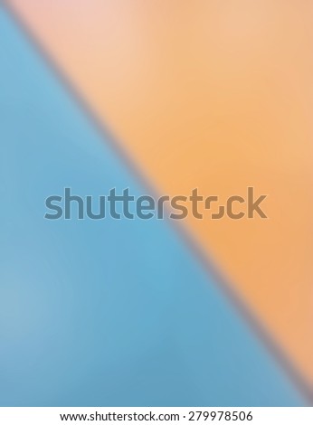 Blurred gap between blue desk and orange desk.