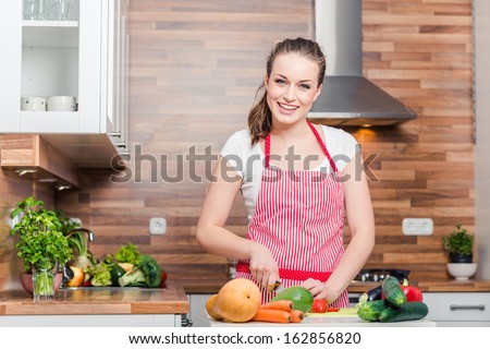 kitchen woman making healthy food standing happy smiling in kitchen preparing salad kitchen woman making healthy food standing happy smiling in kitchen preparing salad
