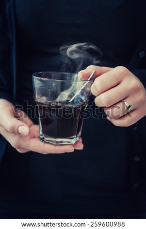 woman hands with black coffee
