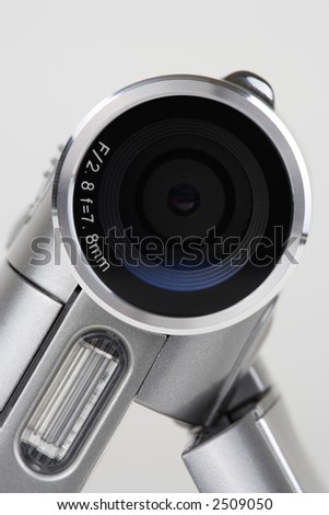 detail lens of digital video camera on white background