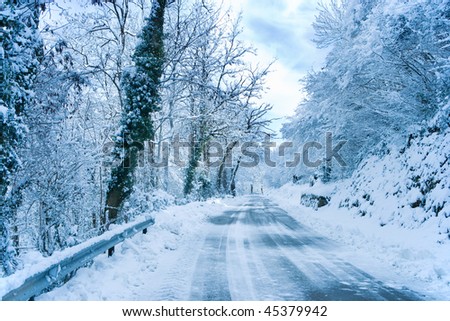 mountain highway with snow. Dangerous curve