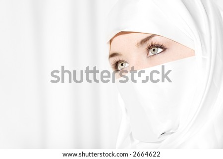 Girl in white face veil with beautiful eyes