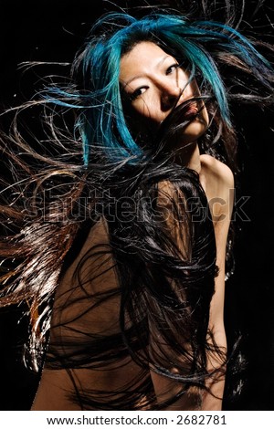 Asian girl with very long hair blowing around