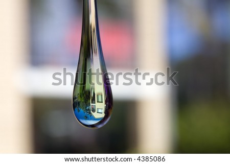 Selective focus on house through water drop crystal