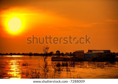 Steamy South East Asian sunset over water