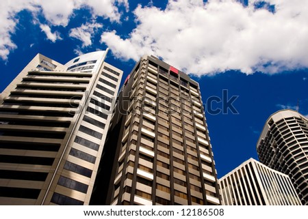Street level shot of city buildings towering above