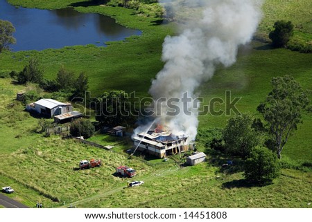 Aerial shot of house on fire with