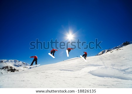 Sequence shot of snowboarder going over jump