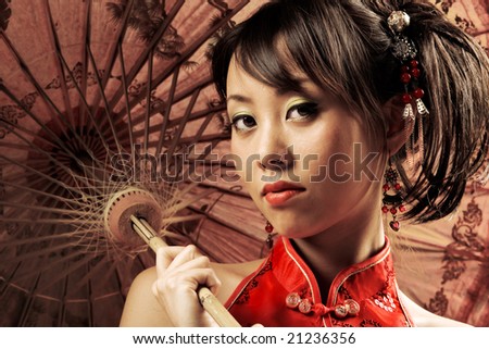 Portrait of a Chinese beauty holding a parasol