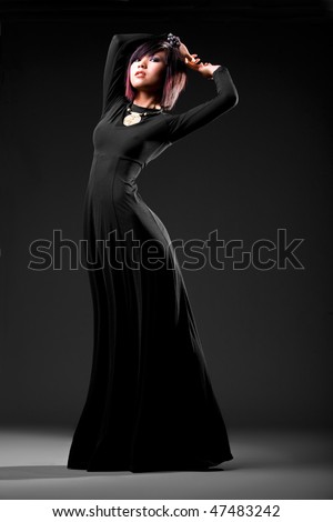 Asian model wearing elegant dress with studio background