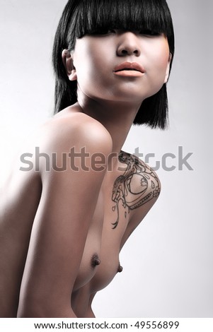 stock photo Beauty image of nude Asian woman on white studio background