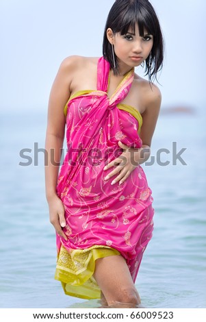 Thai fashion model with ocean in background
