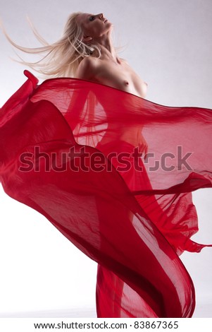 stock photo Beautiful blonde fashion model nude with red cloth