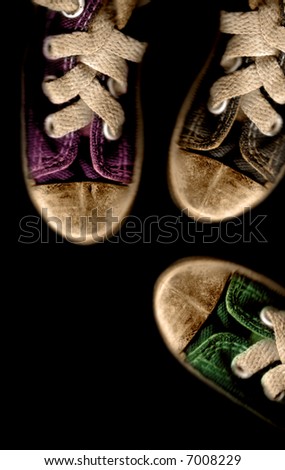 sport shoes- old sneakers isolated on black background