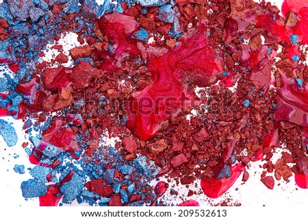 Crushed eye shadow with red nail polish isolated on white background