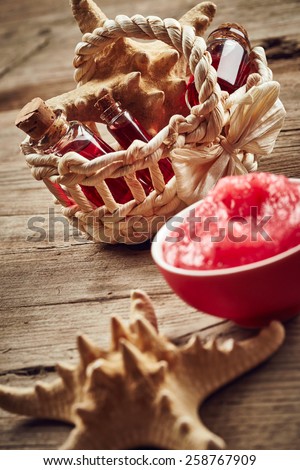 Spa still life with starfish and scrub for body on wooden background