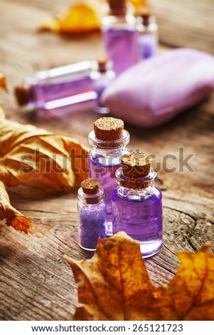 Purple Spa still life with autumn leaves on wooden background