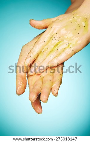 Woman\'s hands in body scrub