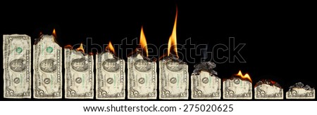 Burning dollars on black background