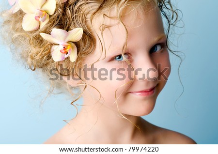 Girl with orchid flowers in hair