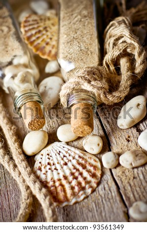 Vintage still life with bottle and seashell