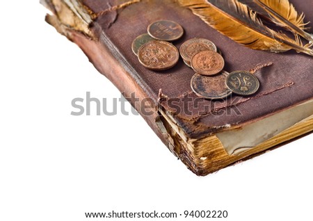 Ancient book with few copper coins on isolated white background